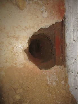 Exploratory holes are dug to evaluate the footing and water table.