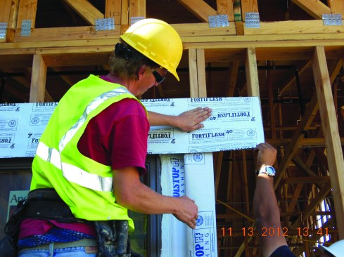 It is followed by a final membrane flashing applied to the outside face of the wall.