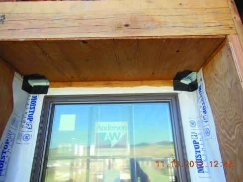 After side flashings are in place, the window unit is installed and flashing corners are installed above the window.