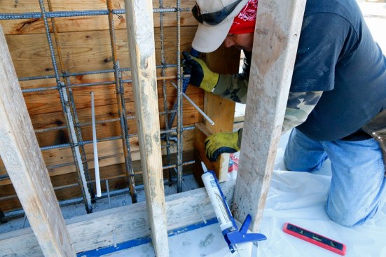 The form builders had to think like finish carpenters, using blue tape to protect the finished slab.