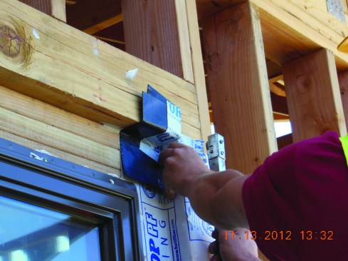Remember that the top corners, not just the bottom of the recessed opening, must also be flashed. Install flashing corners on the inner face near the top of the window first ...