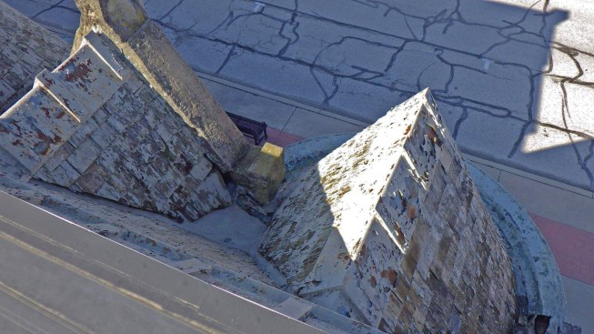A view between the central gable and one turret shows the cricket, which drained out a small hole beneath the central gable’s limestone cap.
