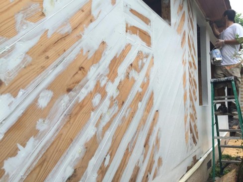 The building’s diagonal sheathing had minimal isolated water damage, so restoring it rather than replacing it was prudent. This involved  applying liquid applied flashing to the sheathing joints.