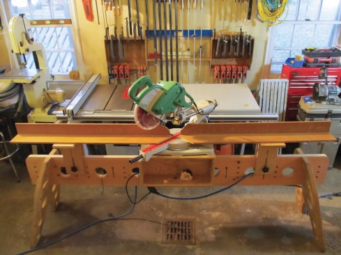 He replaced it with a plywood sawhorse system that can be broken down into flat pieces for transport.