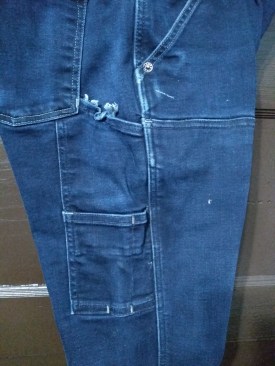 My tape measure clip took care of the side pocket.