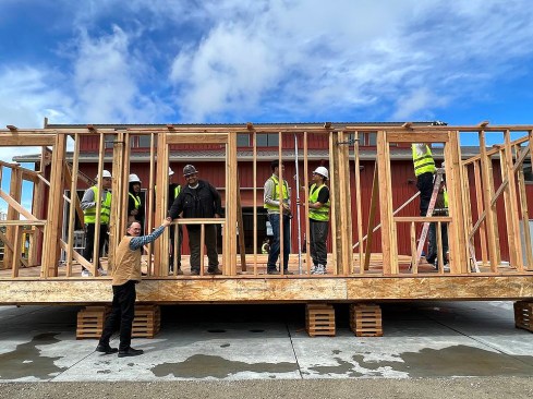 Each module of the Nexus 01 home was designed and built to be lifted with a forklift and trucked to the site, then stacked and arranged, looking nothing like the usual “double-wide” modular.