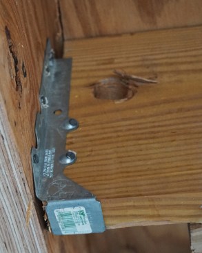 Gaps between the ends of the joists and the LVL beam ranged from 1/4 to 1/2 inch wide.