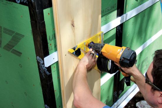 The Zip System sheathing and joint tape form the weather-resistive barrier. To hold the vertical ship-lap board siding off the wall and create a space for drainage and air-drying, Placetailor uses strapping made from corrugated plastic signboard, bought for a few dollars a sheet at an office supply store and ripped into strips.