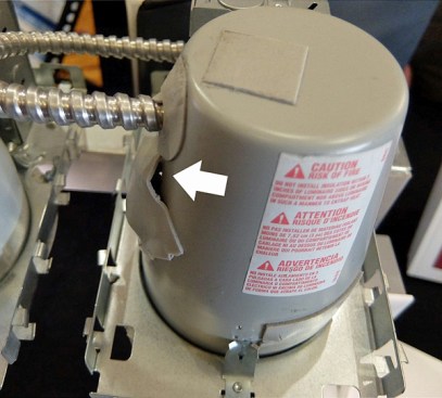 This fixture reportedly meets the code requirement for “airtight, IC rated,” but in fact you can see light through one gasket (white arrow).