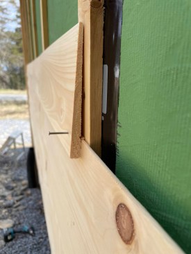 Nails penetrate only the bottom edge of the clapboards, allowing the width of the board to expand and contract without splitting.