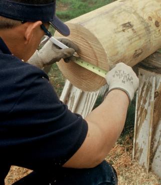 Anchors are rarely centered exactly on the pedestal, so the author carefully transfers the slot layout to ensure that the post will overhang the pedestal evenly.