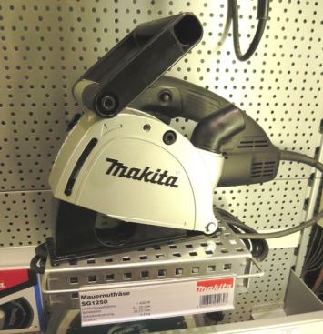 Wall chasers, such as this 
Makita SG1250, are common on European remodeling sites—where masonry construction means there are no stud bays in which to run plumbing and wiring. The wall chaser contains a pair of diamond blades that are used to cut parallel kerfs in concrete and masonry. The waste is chiseled out to form a channel, in which pipes or wires can be run. It’s a terribly messy job so the machines are typically connected to dust-collecting vacs. Many tool companies offer wall chasers and specialized attachments for rotary hammers for cutting in electrical boxes; 
click here to see a Hilti wall chaser in action.