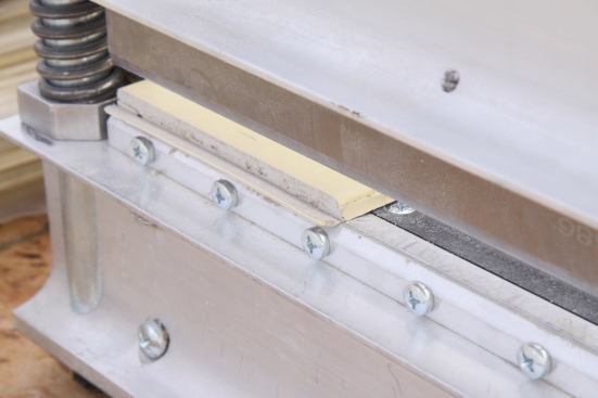 After the cut, the shear leaves a sliver of siding about 1/16" and a clean, crisp edge.