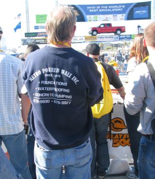 Spectator. That truck in the background is one of the prizes awarded to the winner.