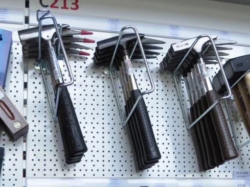 Many German carpenters use latthammers, hammers with square heads and mismatched claws—one long and pointy and the other short and blunt. Most have magnetic nail holders on top. Look them up in a catalog and you will see them described as “carpenter’s roofing hammers”. I don’t know why they call them that, unless it’s because the point could be used to punch holes in slate or because in a part of the world where masonry is dominant the roof is one of the few parts of the house that is framed. What I do know is square heads can drive nails, asymmetrical claws can pull them, and hammers of this kind make for an 
entertaining juggling act.