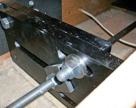 The two-part brackets have sliding adjustment slots to allow for variation in the width of the joist bays.