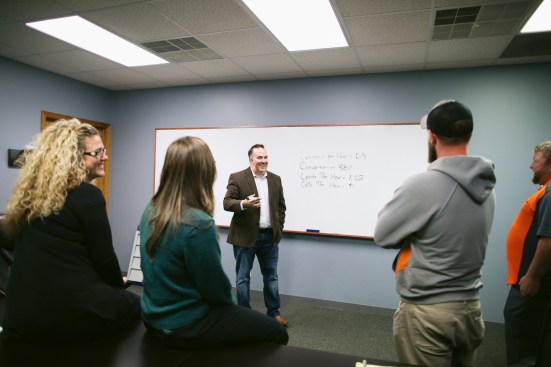 Diamond meets with his team in the office