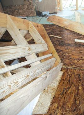 Scribing the Valleys: These plates provided a target for projecting the flare from the gable, which we did by using various pieces of framing lumber, depending on the thickness and angle required.