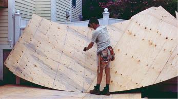 Figure 5. Make a two-layer plywood mirror of the stair layout, with its edges cut 3 1/2 inches wide of the inner and outer radii of the stair.