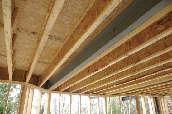 On this project, four MC-10-22 steel beams were bolted to the interior joists on 8-foot centers.