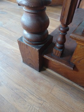The integral block at the base of the newel post measures 6 1/2 inches square and about 10 inches tall.