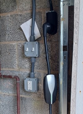 A NEMA 14-50 receptacle wired with a 6-gauge cable running back to a 50-amp breaker in the service panel will work for most mobile connectors.