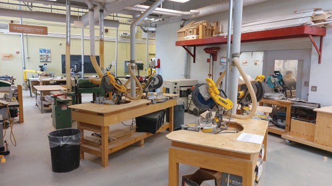 A shop station is set up for trim work and tool familiarization.