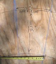 Figure 3. Snap chalk lines between the center point and two adjacent walkline tread marks to outline a tread. Verify that the minimum tread width is at least 6 inches.