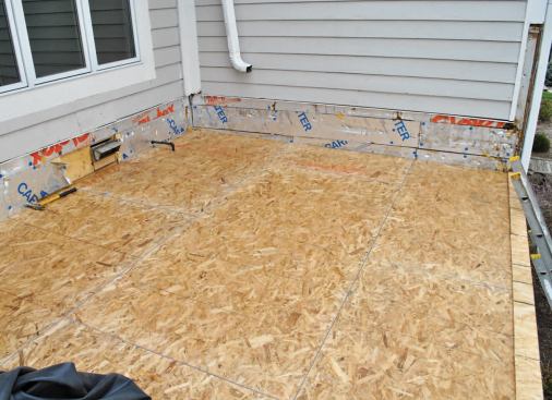 The new OSB decking slopes 4 inches over 11 feet — an additional 3 inches of rise.