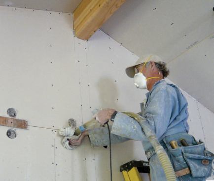 The remaining cavities were filled from inside the building, after it had been determined that the drywall was dry enough to resist bulging or tearing at the screws.