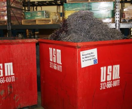 Like every company that does machining, Klein recycles metal chips and shavings. The bin on the right contains clean chips and shavings – which have a certain value to metal recyclers. The bin on the left has been designated for swarf. I didn’t make that up; swarf is an actual thing. Swarf is turnings and chips that contain cutting fluids and contaminants that make them less valuable because they are harder to recycle. So obviously, you’d want to keep the two types of byproduct separate.