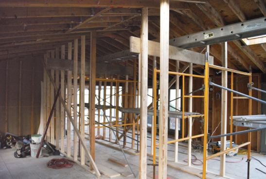 Before removing the interior bearing wall, we built temporary supporting walls on either side.