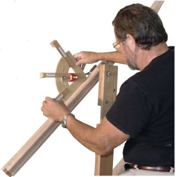 To mark the top cut on a volute easing, I set the protractor on the positioned handrail, then swivel the arm until the bubble reads level and tighten the set screw.
