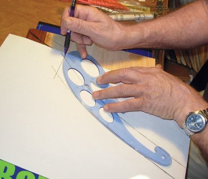Make a Paper Pattern: I bisect the angle with the French curve. From this drawing I make the wood template I need to rout the tread and return.