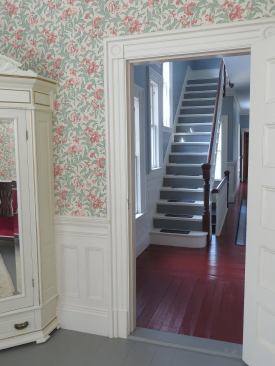 The bedrooms on the second floor have a different casing profile with rosettes in the corners and back banding around the whole perimeter of the casing. Plinth blocks were used in some instances as in this doorway.