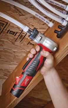 To join Uponor's AquaPEX tubing to its ProPEX fittings, you slip a ring over the end of the tubing, stretch the ring and tubing with an expansion tool, then slip them over the fitting and let them shrink to a leak-free fit. The M12 ProPEX expansion tool makes the job easy and fits into tight spaces.