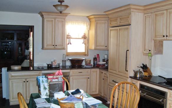 After: Note the boxed-out column at the right rear of the new refrigerator, which encloses a lally column positioned where the original exterior wall used to be.