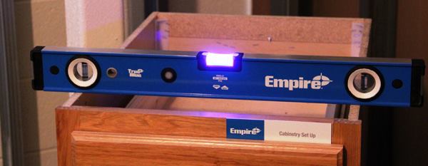 UltraView LED Levels. Last year Milwaukee acquired Empire Level, which is located just 20 miles away from Milwaukee HQ. The most interesting new product from Empire is their UltraView LED Level, a box level with an LED at either end of the vial. Other brands of levels are available with illuminated vials; according to Empire theirs is different because the light is even and produces not glare—so it’s easier to read in the low-light conditions found on jobsites. The level is powered by easily replaced AA batteries. The LEDs are activated by a push-button switch: press once for level vial, again for plumb, and hold for three seconds to turn the lights off. The unit automatically powers down after two minutes and will flash upon activation if the batteries are low. 
Click here for video. Available: April 2016.