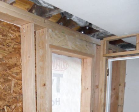 Birdsmouths were cut into the rafters to accommodate the new 2x6 wall framed on top of the Parallam.