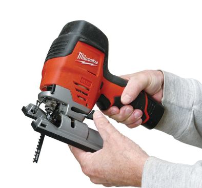 The shoe tilts 45 degrees either way for beveling. You release and lock it by moving the lever below the trigger.