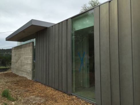 Steel siding now covers the Aluma Flash