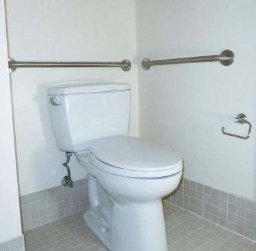 Like the shower, the high-rise toilet is equipped with grab bars securely fastened to wood blocking.