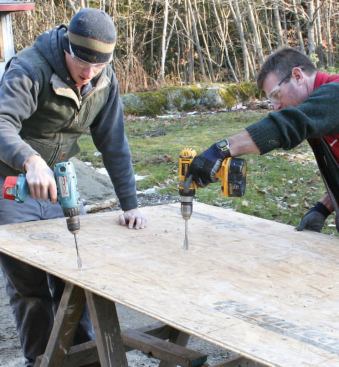 Carpenters predrilled countersunk holes for the structural screws.