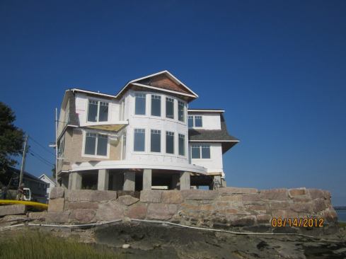 This Connecticut shoreline house under construction in the V zone on the Connecticut shore replaces a beachfront cottage destroyed by Hurricane Irene in August, 2011. Hurricane Sandy this year did not flood the house, reports architect Russ Campaigne.