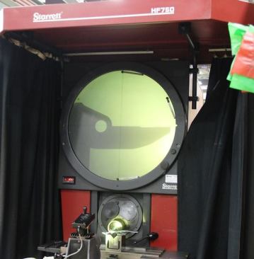 This is an optical comparer; it’s used to inspect pieces after they are machined. It’s basically, a giant magnifier. The image on the screen is a close-up of the lineman’s pliers part clamped below.