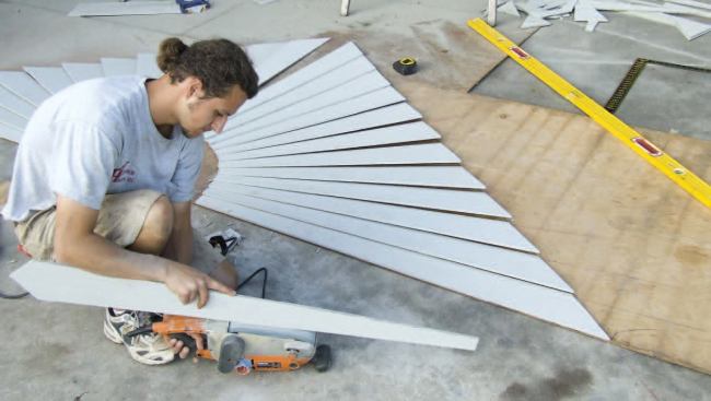 After cutting out the last piece, I smoothed both its edges with a belt sander.