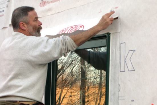 I fold the housewrap flap down over it...