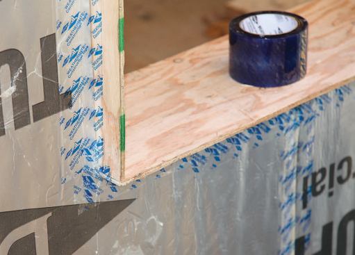 Air-sealing tape is used on the first layer where it intersects the projecting window bucks.