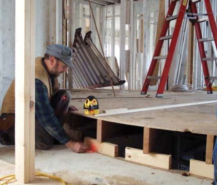 The curved bottom plate is located by plumbing down from a laser attached to a trammel that pivots off the center point.