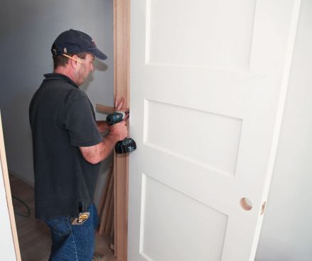 Here's how to install top-quality, solid-core doors that weigh 100 pounds or more.
